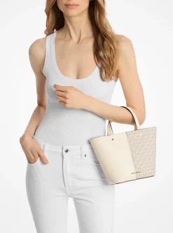 Bolsa a tiracolo em pele granulada e com logótipo exclusivo Flora média | Michael Kors [PT]