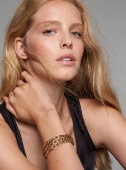 Pulseira rígida com elos achatados com logótipo e incrustações em prata de lei banhada a ouro de 14K | Michael Kors [PT]